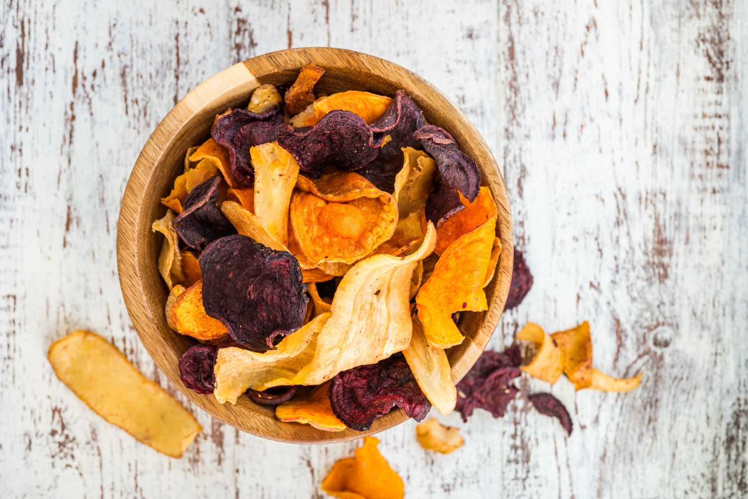 A bowl of root vegetable crisps, made with parsnips, beetroot, carrots and sweet potatoes